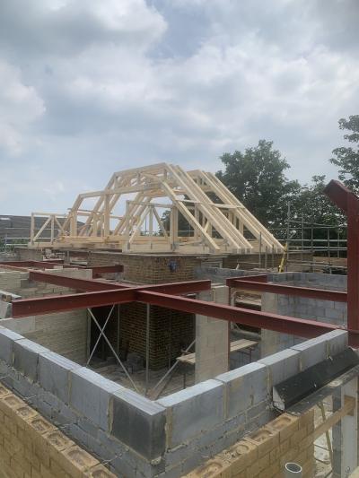 Roof Trusses Being Placed on Construction of New Extension 