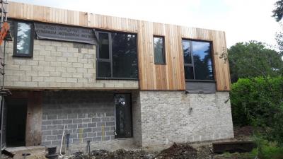 Construction of Cladding and Installation of Windows